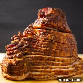 Double-Smoked Ham Techniques for Rich, Smoky Flavor 17 Close up of spiral sliced ham that has been double smoked on the Traeger.