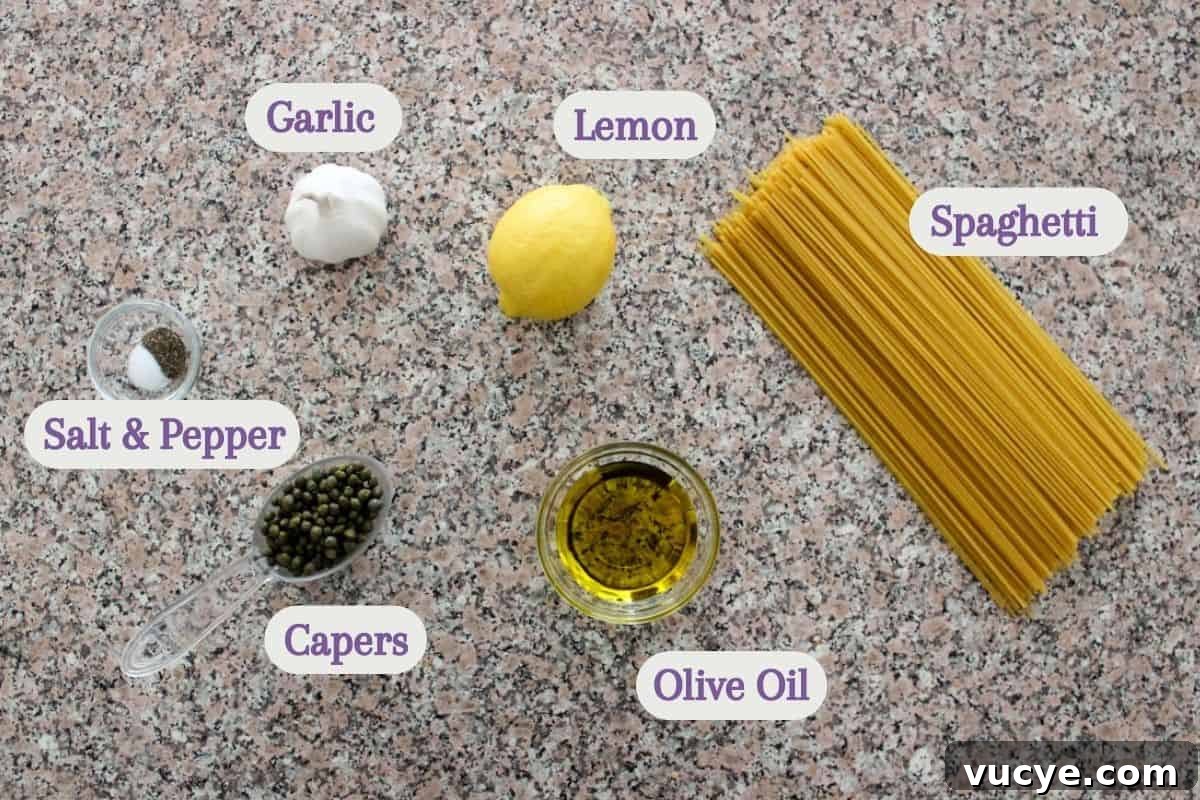 Zesty Lemon Caper Pasta with Garlic and Parmesan 3 Labeled ingredients on a kitchen counter: garlic, lemon, spaghetti, salt and pepper, capers, and olive oil.