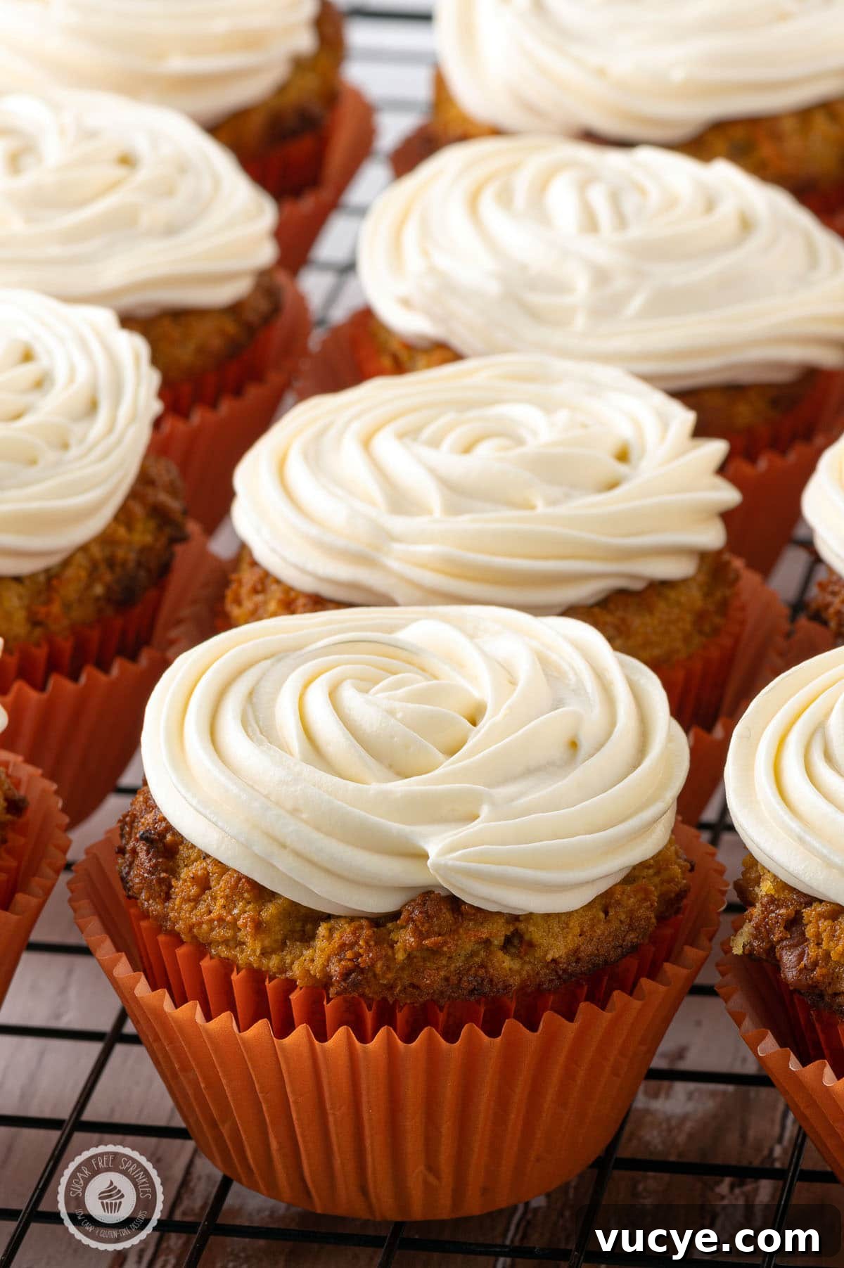 Low-Carb Carrot Cake Muffins with Cream Cheese Frosting 7 Stacks of freshly baked muffins with perfect swirls of cream cheese frosting