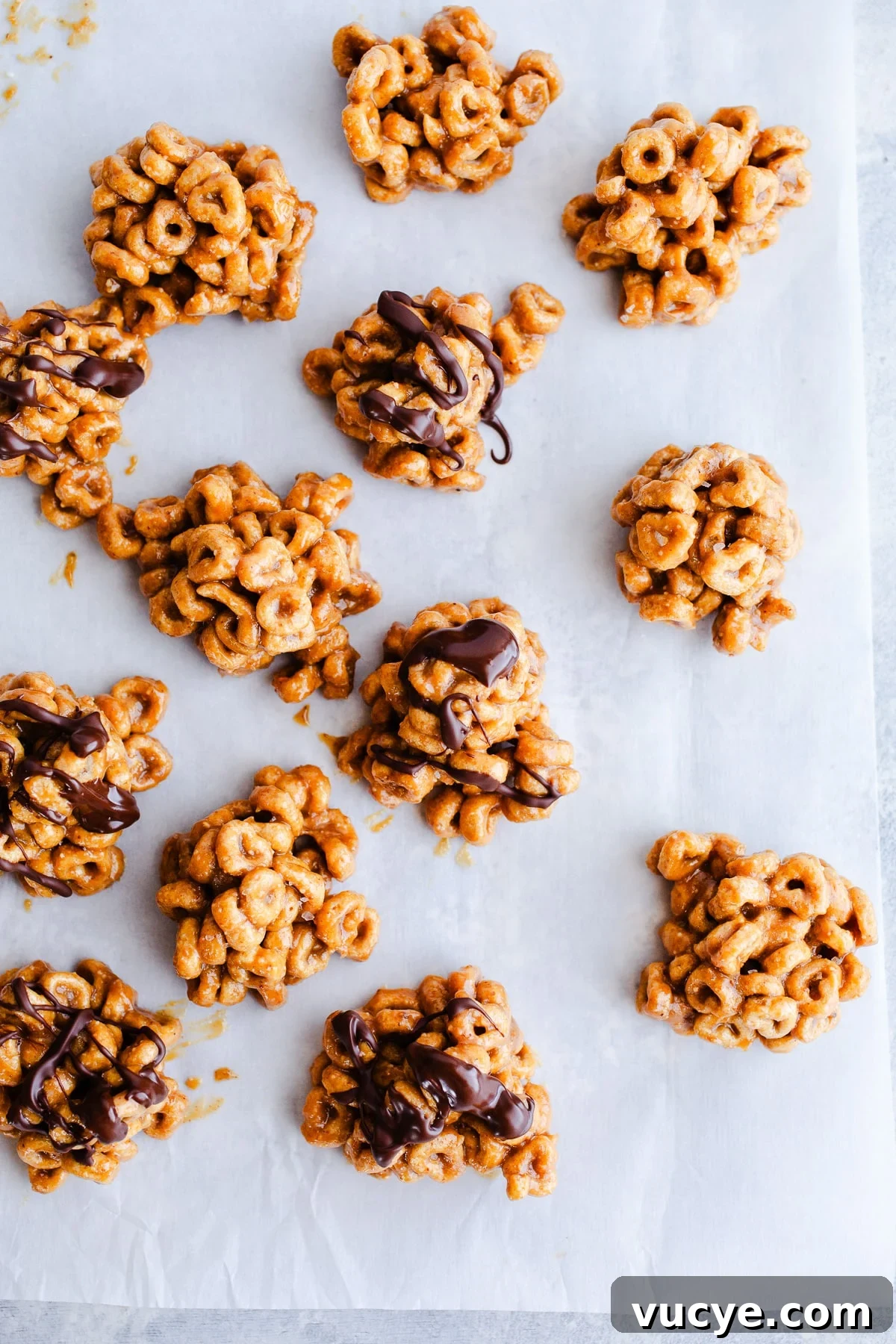 3-Ingredient Peanut Butter Cereal Bites Recipe 2 Peanut butter bites on a baking sheet.