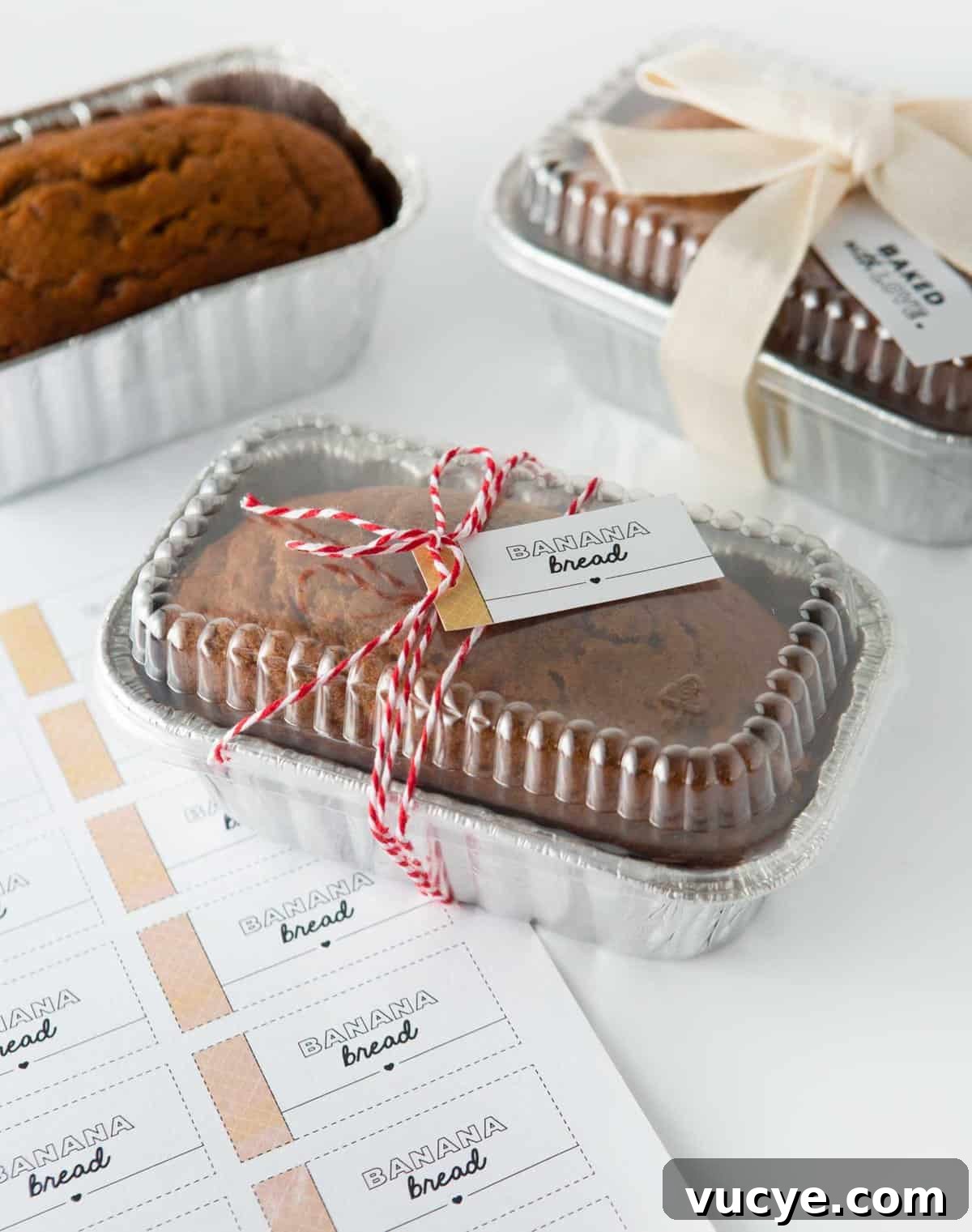 Mini Banana Bread Loaves: Quick Recipe for Moist, Individual Cakes 2 mini foil loaf pan of banana bread with gift tag