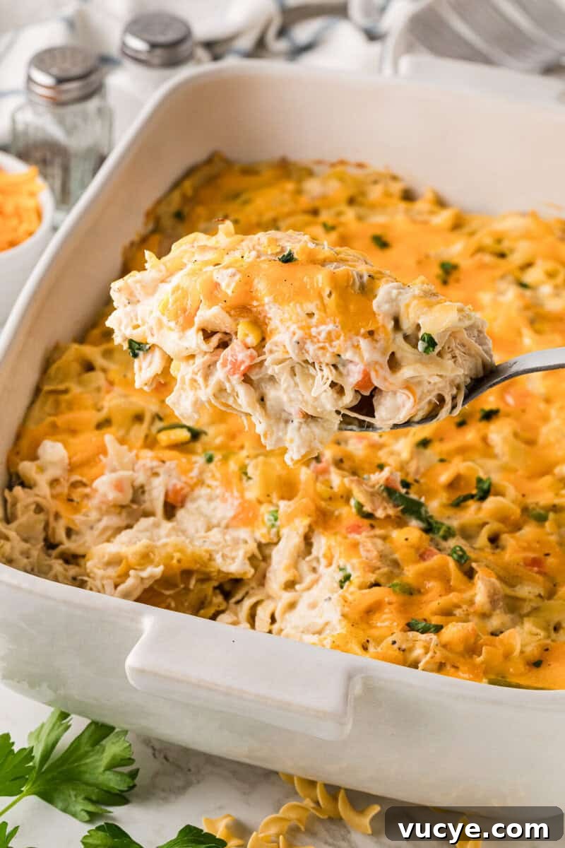Creamy Chicken Noodle Casserole with Crispy Topping 8 serving the Chicken Noodle Casserole out of the baking dish.