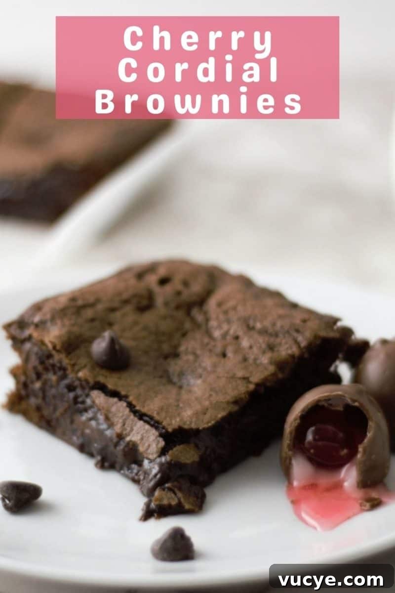 Chocolate Cherry Brownies with Gooey Chocolate Ganache 8 a Chocolate Covered Cherry Cordial Brownie on a plate.