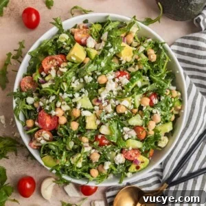Top Rotisserie Chicken Recipes You’ll Want to Try 18 Chickpea avocado salad in bowl with arugula, feta, cucumbers, tomato and other ingredients.