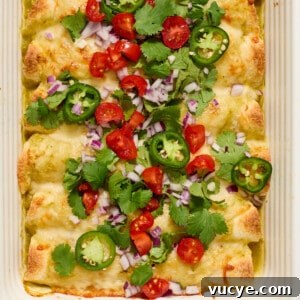 Top Rotisserie Chicken Recipes You’ll Want to Try 5 Pan of green chicken enchiladas topped with onion, cilantro, tomatoes, etc.