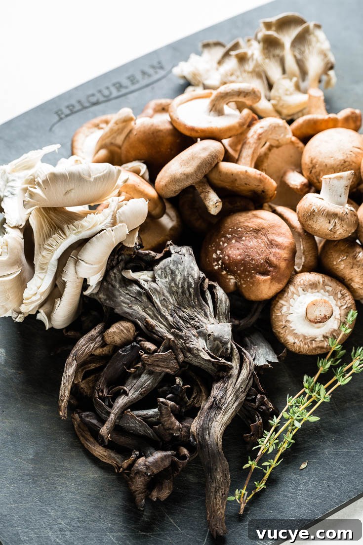 assorted wild mushrooms on cutting board