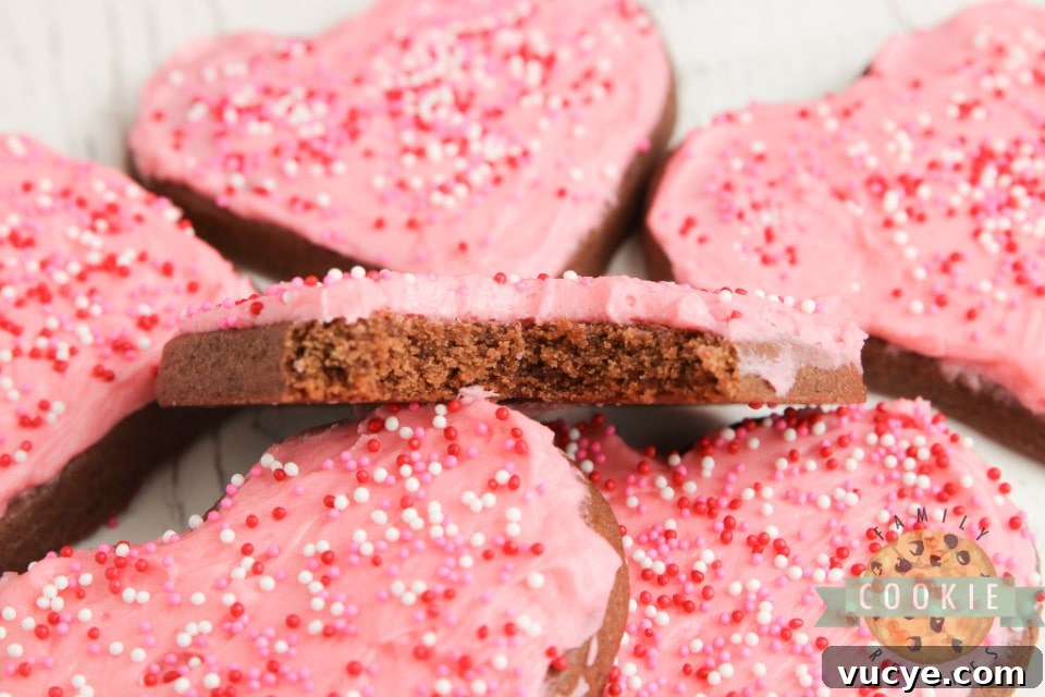 Soft chocolate sugar cookies decorated with frosting and sprinkles.