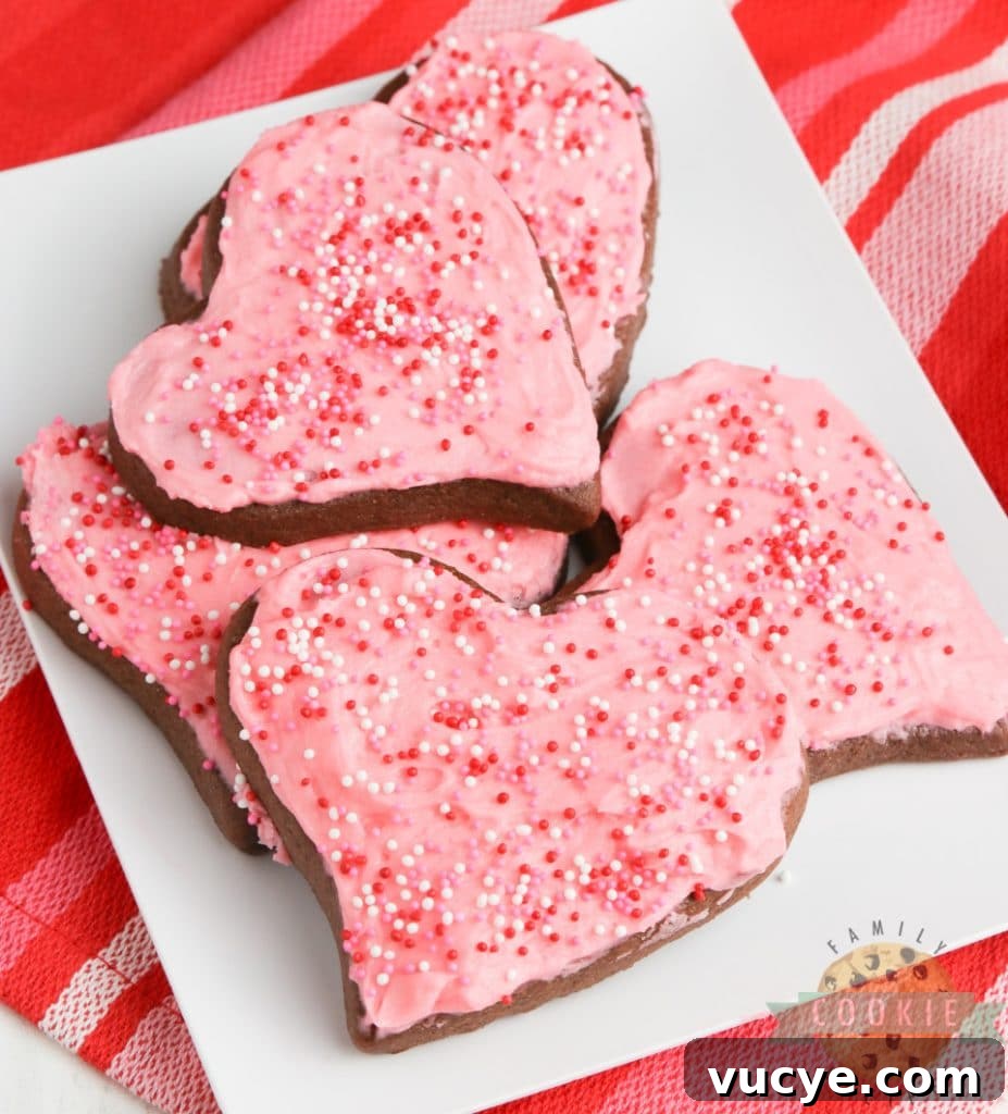 Valentine’s Day chocolate sugar cookies with festive decorations.