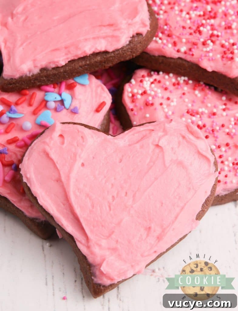 Valentine’s Day chocolate sugar cookies with festive decorations.