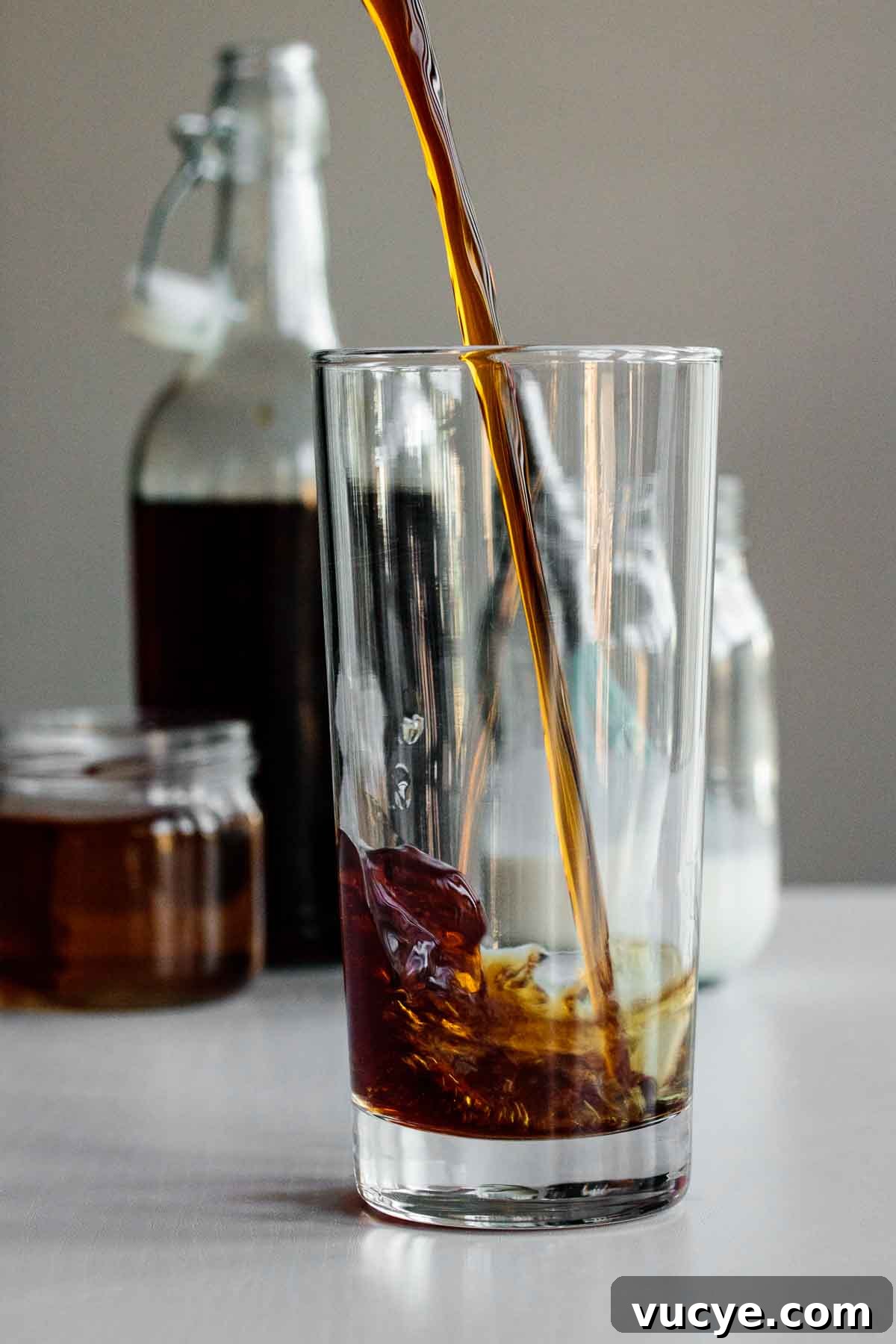 Starbucks Vanilla Sweet Cream Cold Brew Recipe & Tips 3 cold brew being poured into tall glass