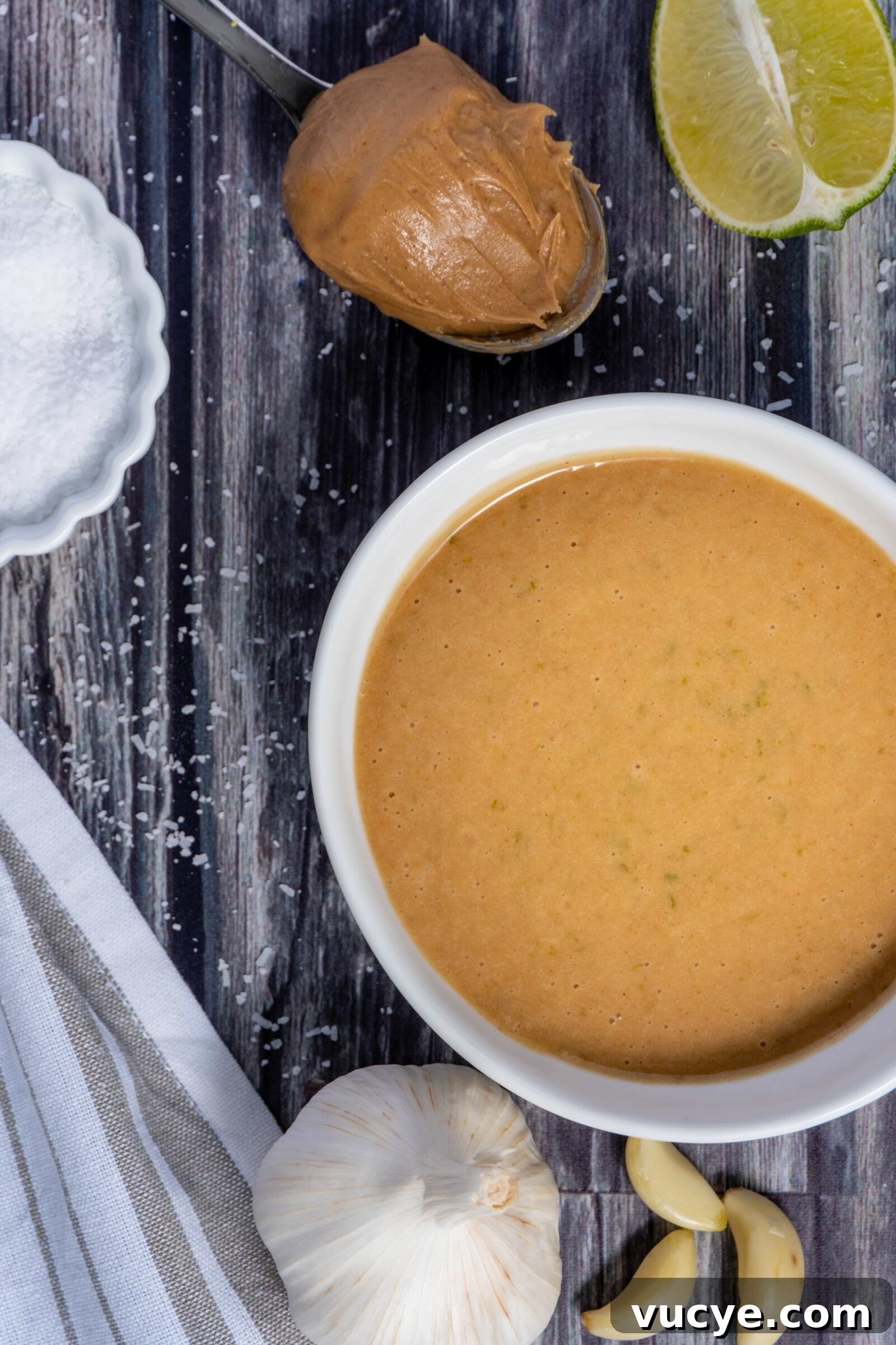 Peanut butter, lime juice, lime zest, garlic, sugar, and soy sauce, make up this peanut-lime vinaigrette