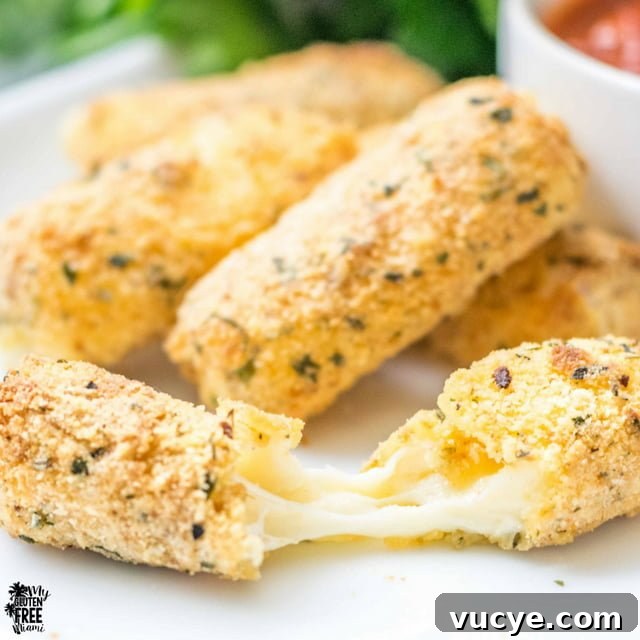 Crispy Gluten-Free Air Fryer Mozzarella Sticks Recipe 5 gluten free air fryer mozzarella stick broken to show cheese