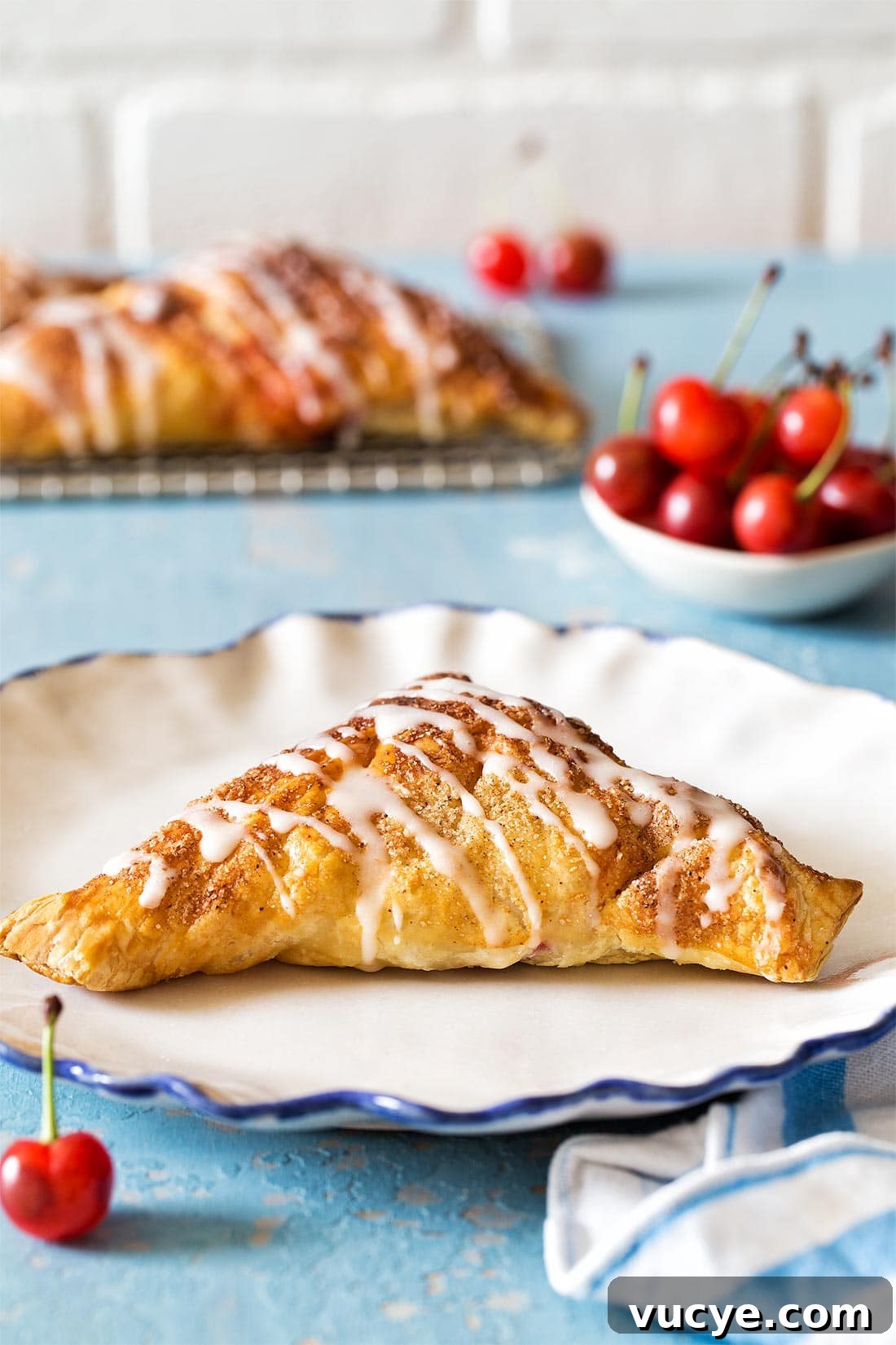 Puff Pastry Cherry Turnover on white plate
