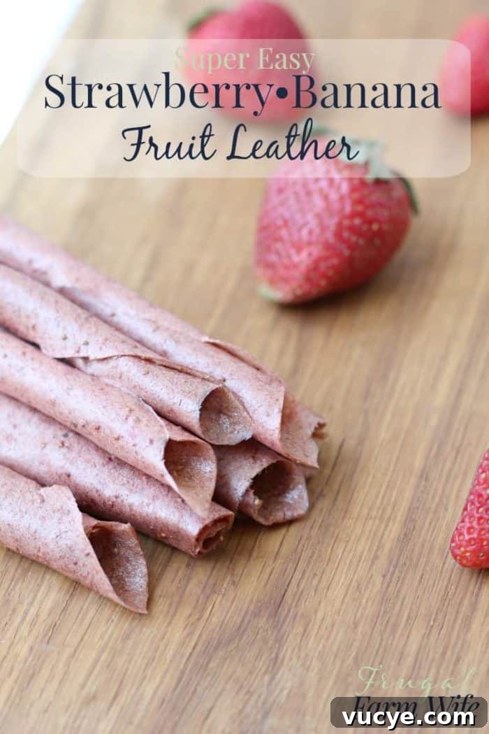 Strawberry Banana Fruit Leather Recipe for Homemade Snacks 2 Image depicts a stack of homemade fruit leather with the text "Super Easy Strawberry Banana Fruit Leather"