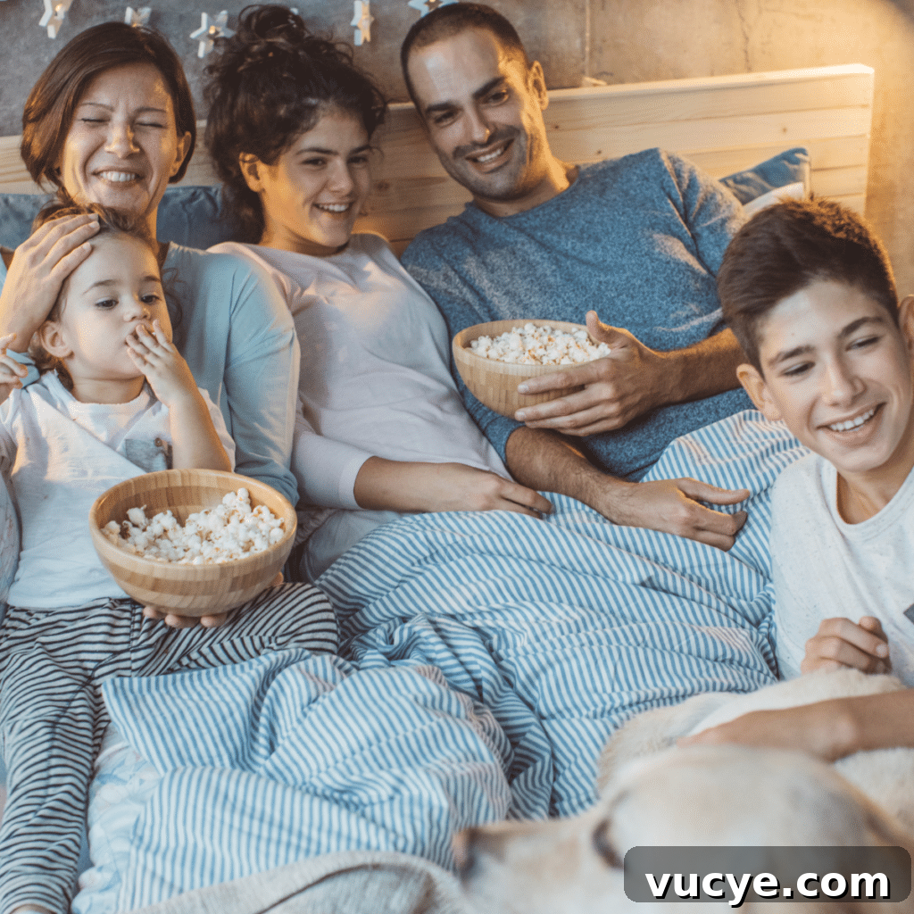 Big family and their dog enjoying togetherness in bed