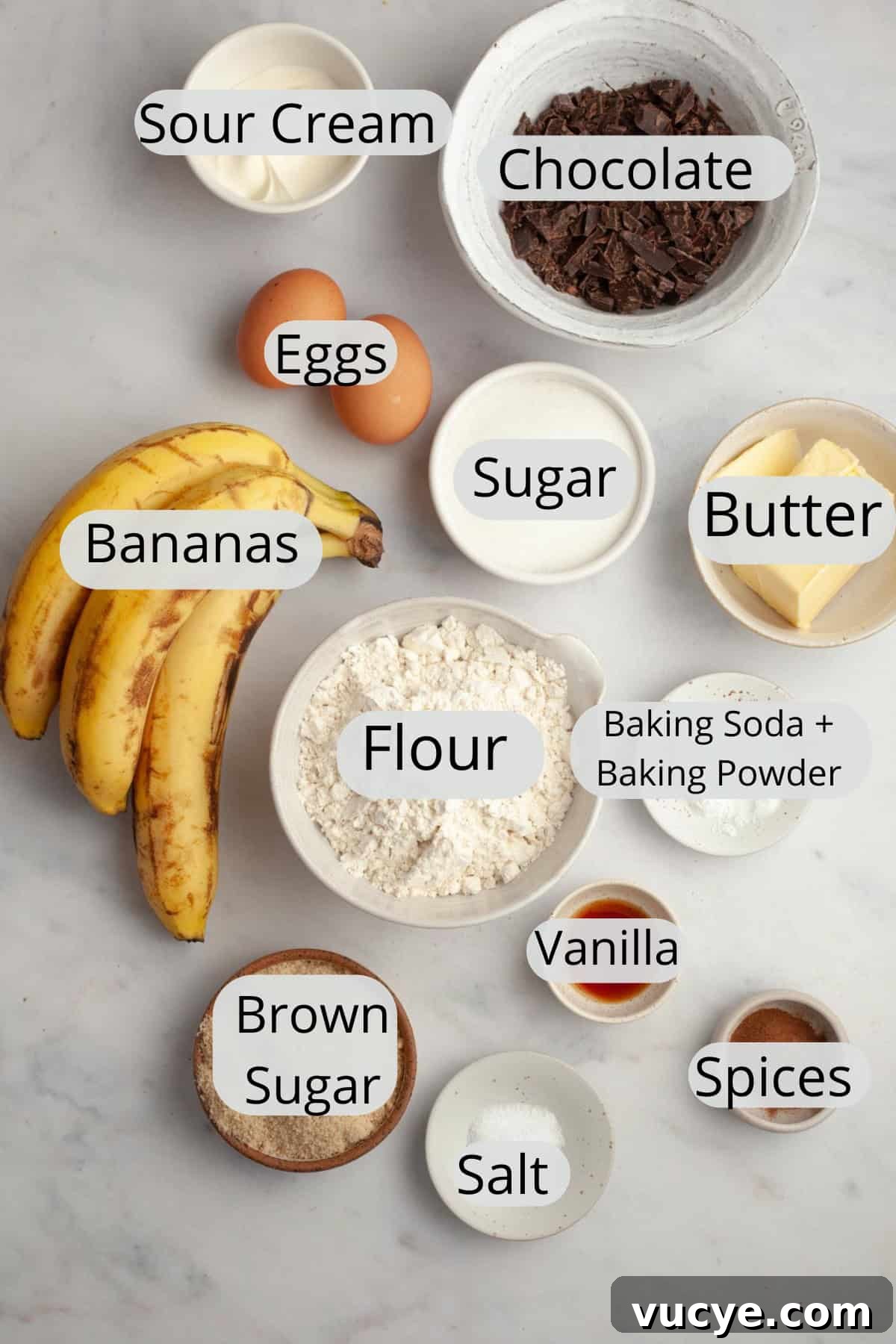 Bakery-Style Chocolate Chunk Banana Muffins Recipe 4 All the ingredients needed to make chocolate chunk banana muffins, weighed out into small bowls.