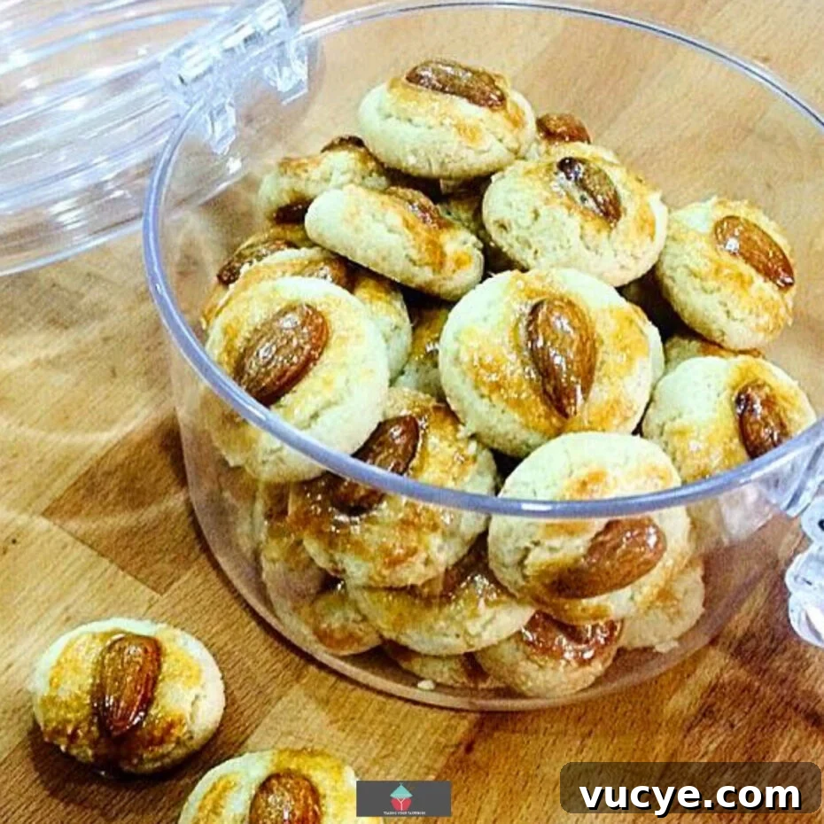 Classic Chinese Almond Cookies: Recipe & Baking Tips 4 Chinese Almond Cookies are simple little cookies, traditionally made for Chinese New Year. These cookies are soft, fluffy, and crumbly. The shape symbolizes coins and will give you good fortune in the coming new year! Easy recipe and are so addictive, be sure to make plenty!
