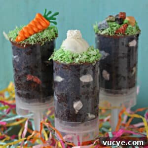 Easter Egg Cookies Topped with Smooth Fondant Decorating Ideas 2 Two push-up pops filled with chocolate cake and topped with bunny ears and a chocolate carrot.