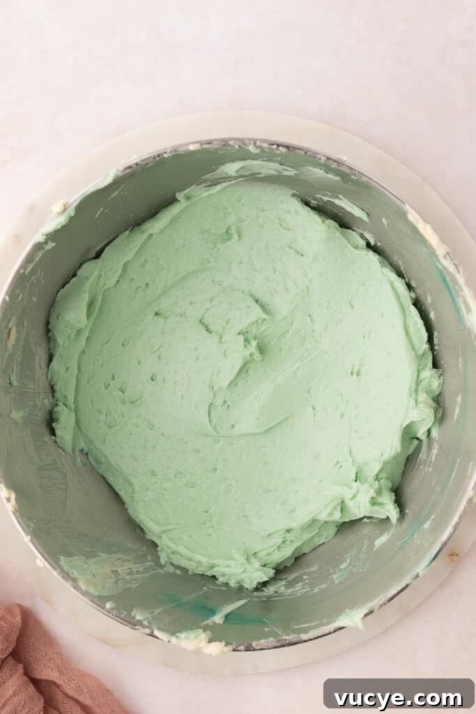 Silky Swiss Meringue Buttercream Recipe for Perfect Frosting 13 and briefly beat until the buttercream is a uniform color. Transfer the buttercream to a piping bag fitted with a tip. Pipe the buttercream on top of the cooled cake or cupcakes.