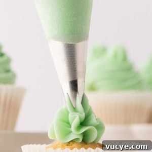 Silky Swiss Meringue Buttercream Recipe for Perfect Frosting 16 closeup of swiss meringue buttercream being piped