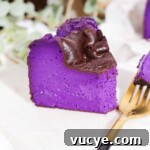 Ube Basque Burnt Cheesecake Recipe: Creamy Filipino Dessert 9 Thumbnail of a fork next to a slice of ube basque cheesecake.