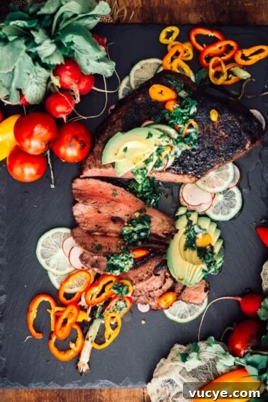 sliced trip tip topped with chimichurri and avocado