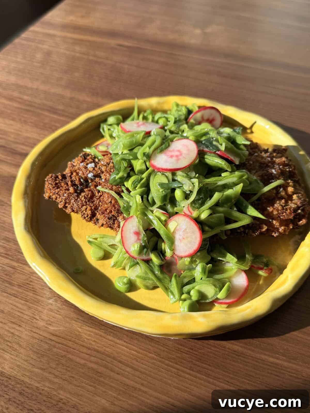 Breaded chicken thighlets on a plate
