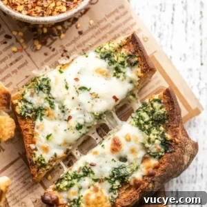 a slice of cheesy garlic bread cut in half