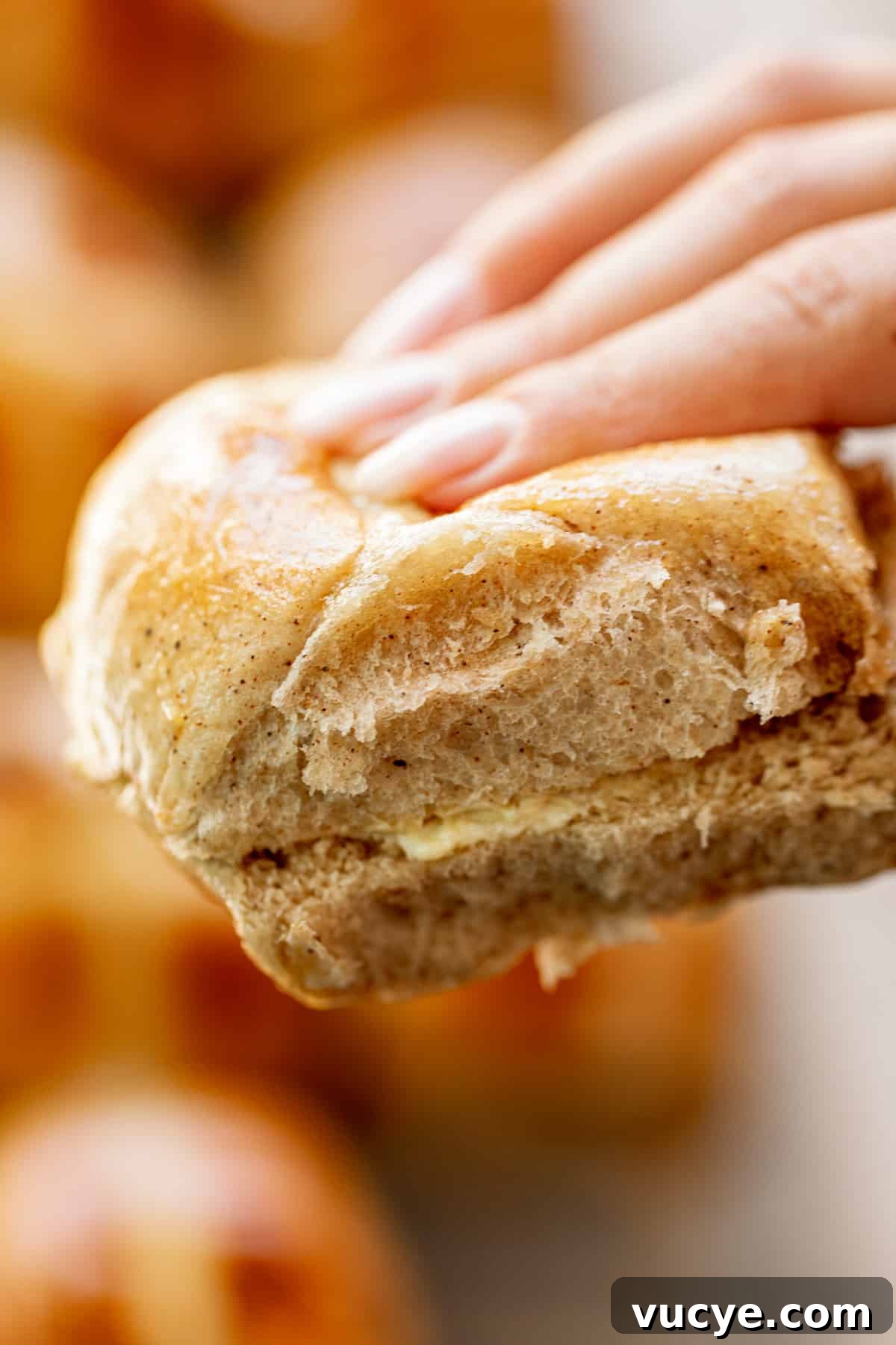 Holding Hot Cross Buns in fingers