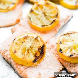 Maple Teriyaki Salmon Rice Bowls with Sesame & Scallions 7 Grilled salmon filets topped with grilled lemon slices.