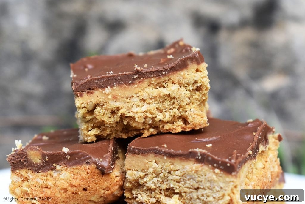 Peanut Butter Bars are a peanut butter oat slice that’s sweet and chewy and topped with a peanut butter chocolate ganache.