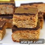 Peanut butter oat slice on a white plate.
