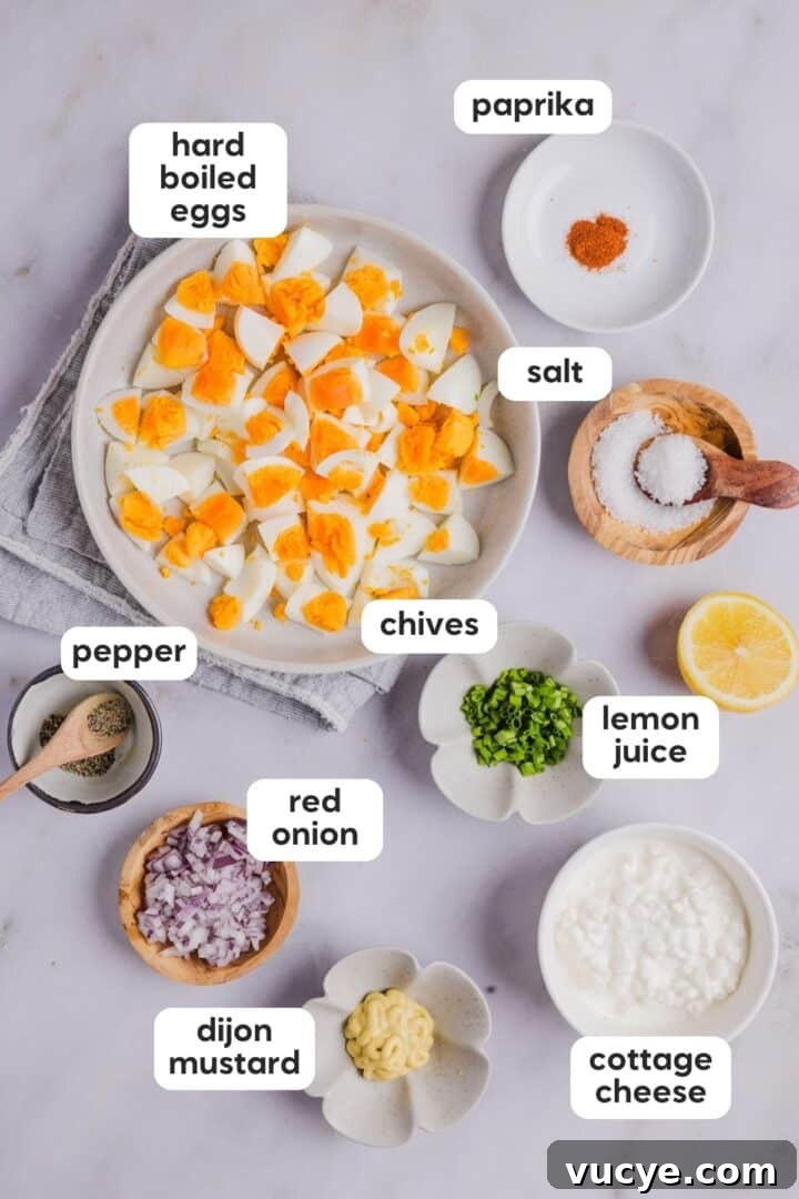 Labeled photo of cottage cheese egg salad ingredients on a grey kitchen counter