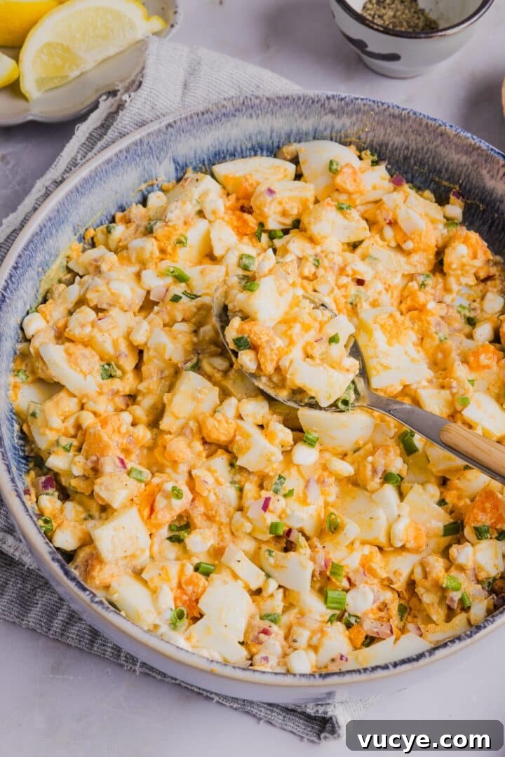 Cottage cheese egg salad in a bowl with a spoon
