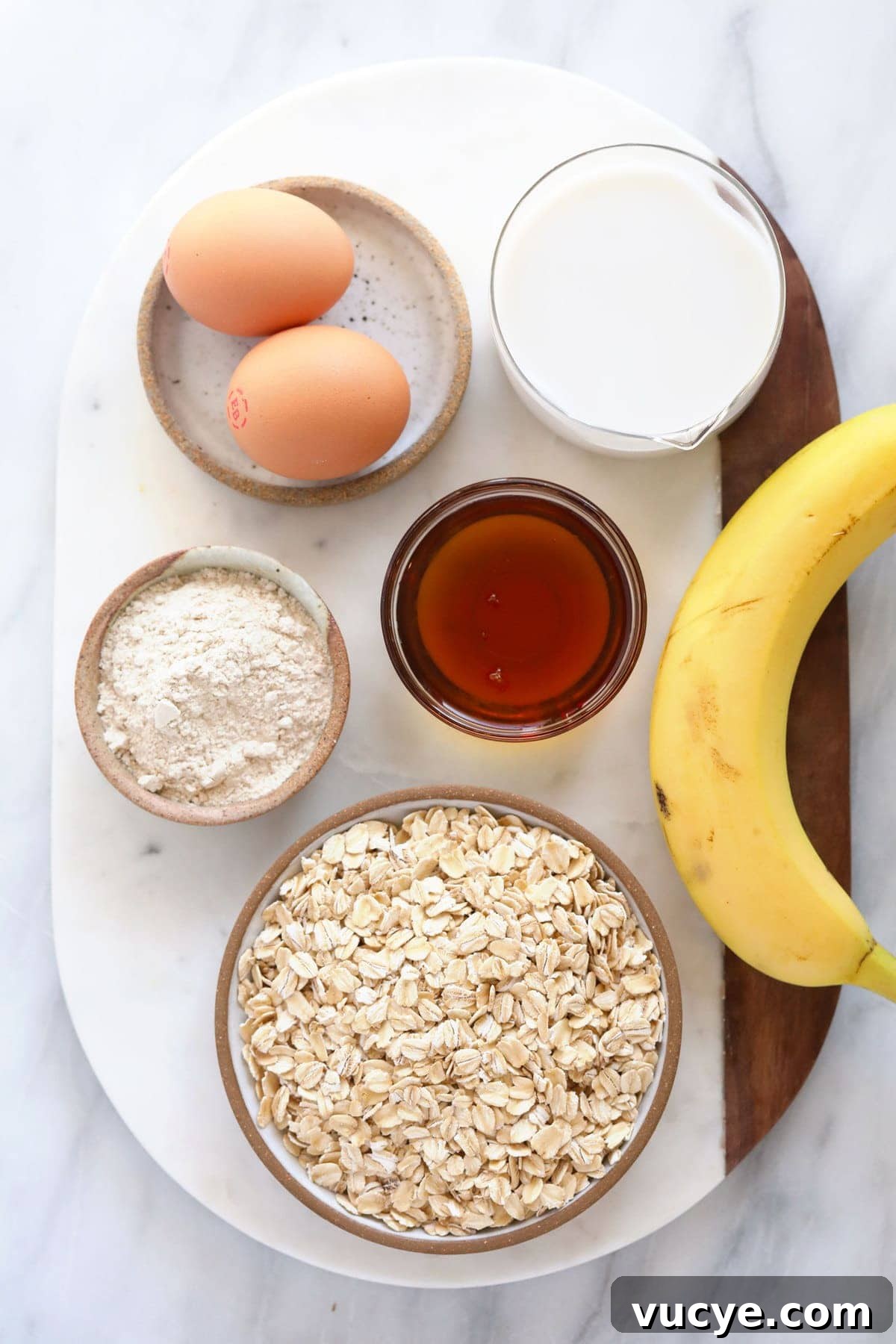 Chewy Baked Oatmeal Casserole with Berries and Cinnamon 3 oatmeal, eggs, flour, banana, milk, and maple syrup