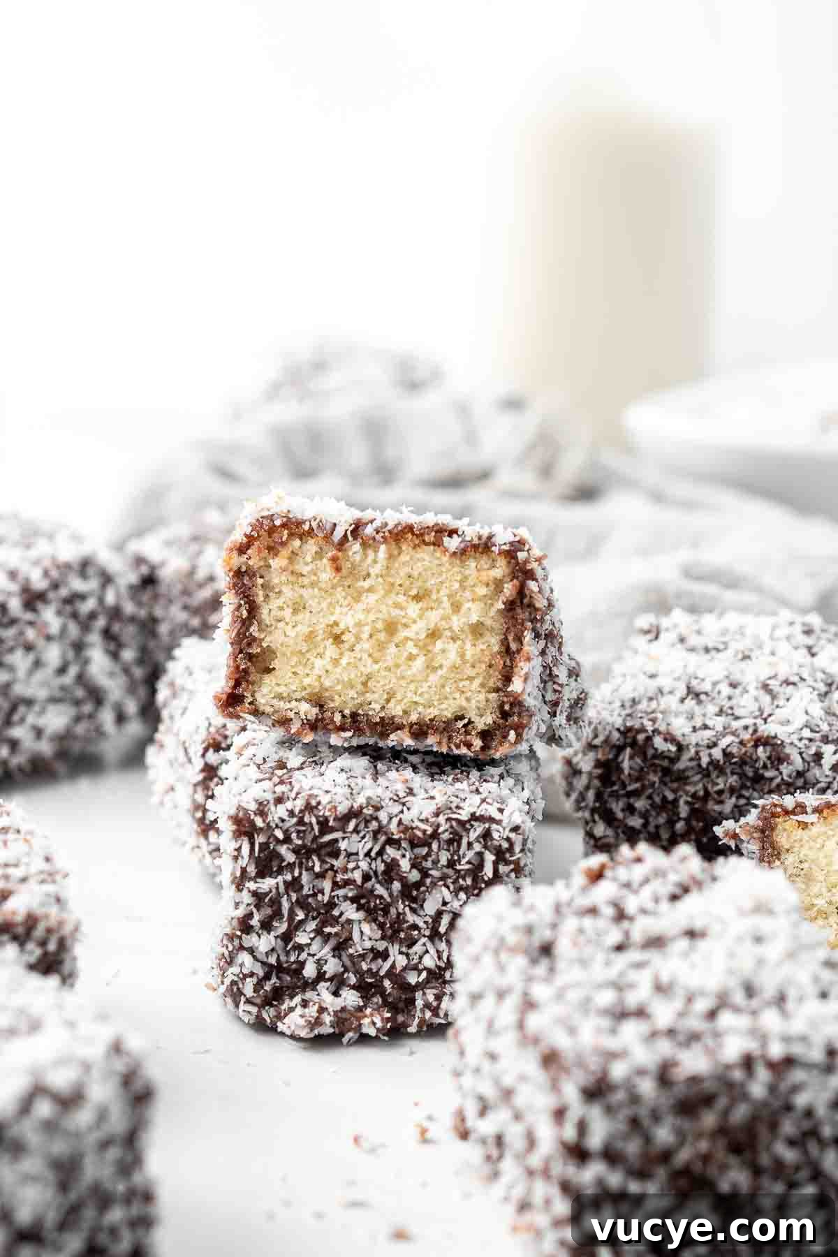 Classic Australian Lamington Recipe: Moist Sponge Cakes with Chocolate & Coconut 2 Close up of the inside of a lamington.