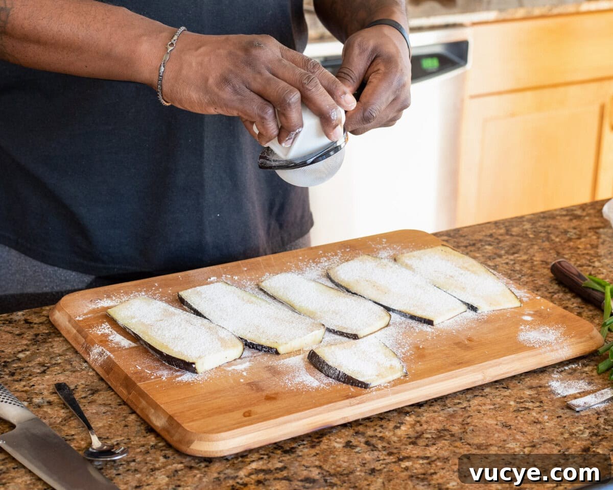 Soy-Glazed Eggplant Recipe: Savory Stir-Fried Japanese Aubergine 5 sifting cornstarch over slices of eggplant