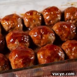 Sweet Raspberry-Glazed Meatballs With Tangy Sauce 3 Finished tray of glazed meatballs