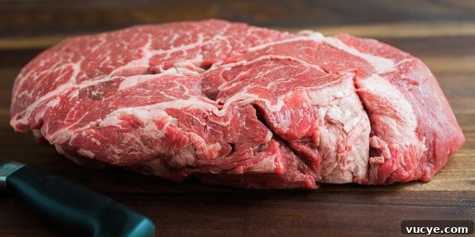 Beef Chuck Roast | Striped Spatula whole marbled beef chuck roast on a cutting board