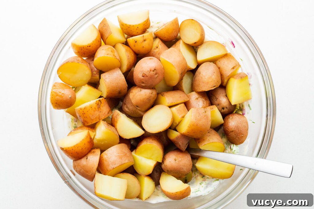 Cooked red potatoes in a large bowl.