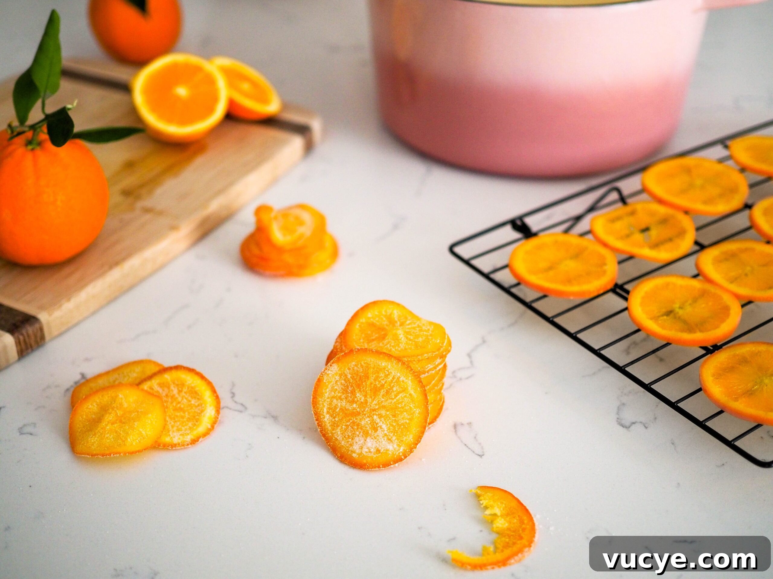 Candied Orange Slices Recipe: How to Make Sweet Orange Candy 4 A stack of candied orange slices, with one missing a bite.