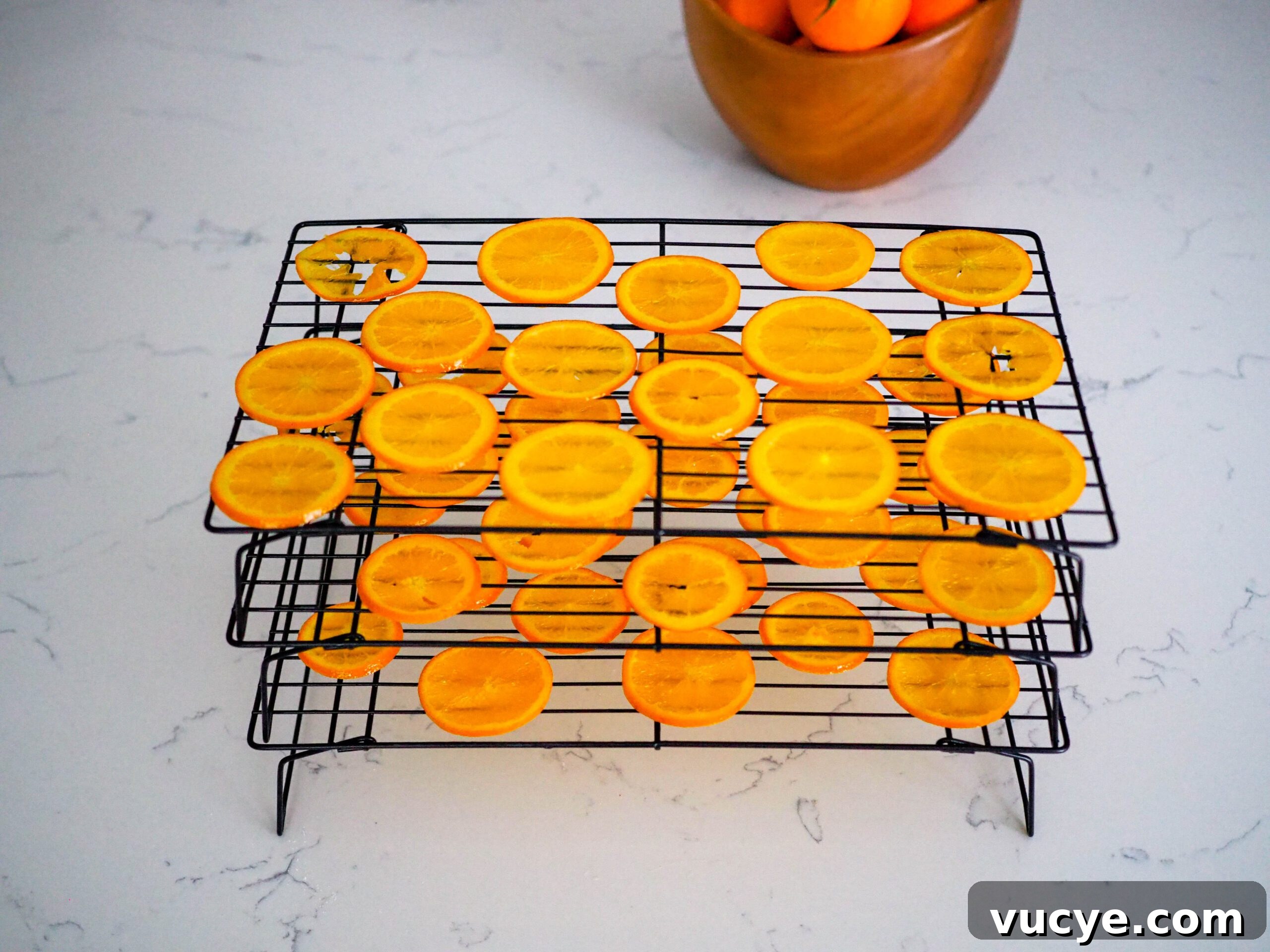 Candied Orange Slices Recipe: How to Make Sweet Orange Candy 6 Stacked drying racks with orange slices on them.