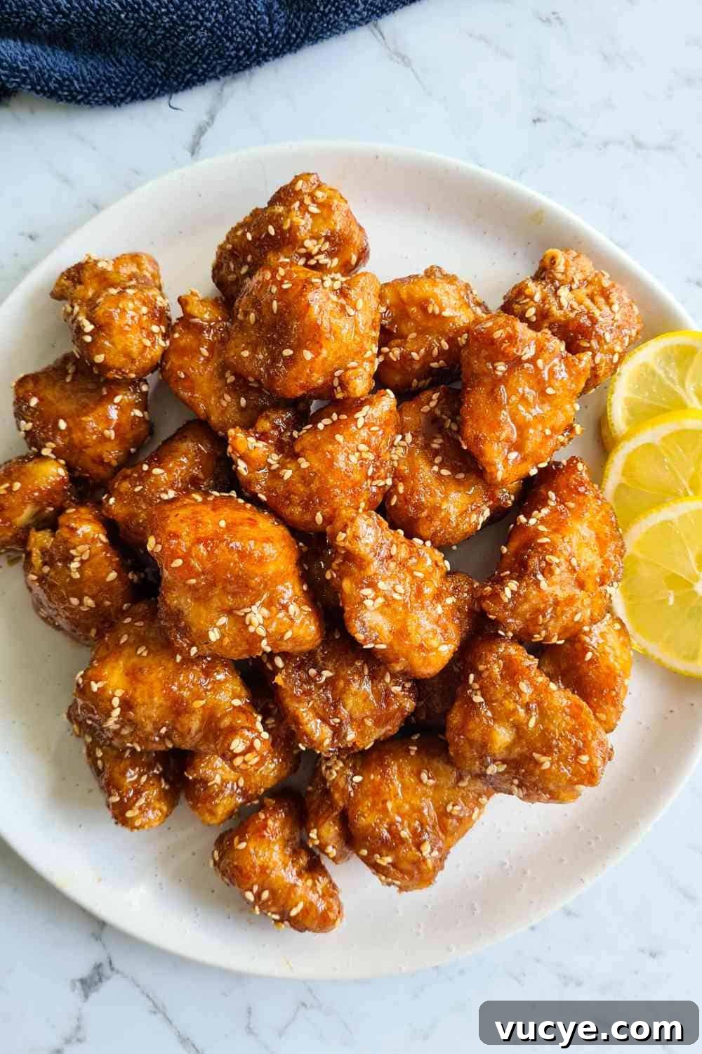 An overhead view of a plate of fried chicken pieces