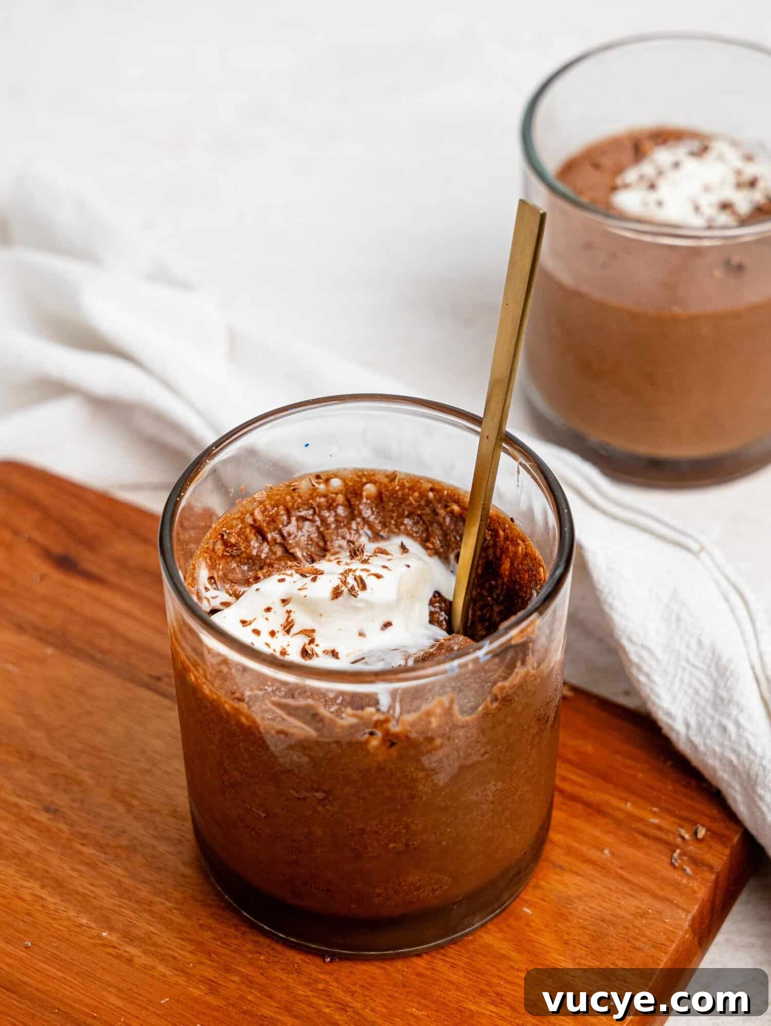 Chocolate Protein Mousse in a glass cup.