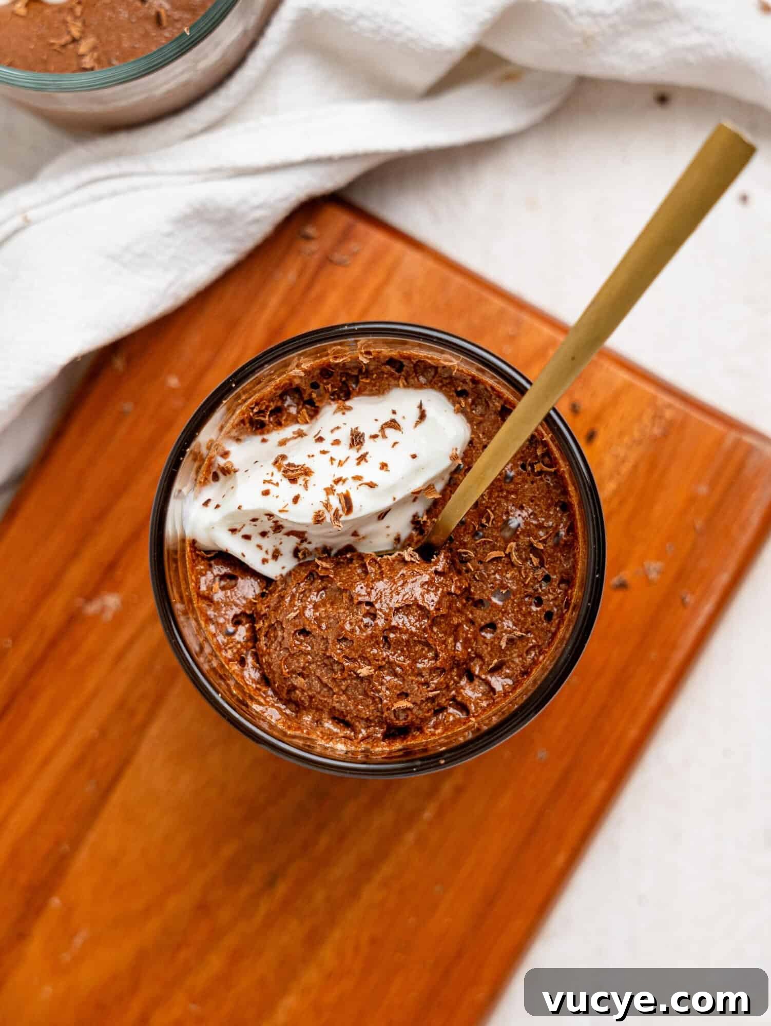 Bird's eye view of a spoon in protein chocolate mousse.