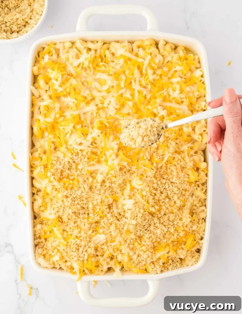 Creamy Baked Macaroni and Cheese Casserole Recipe 16 adding the bread crumb topping to the mac and cheese