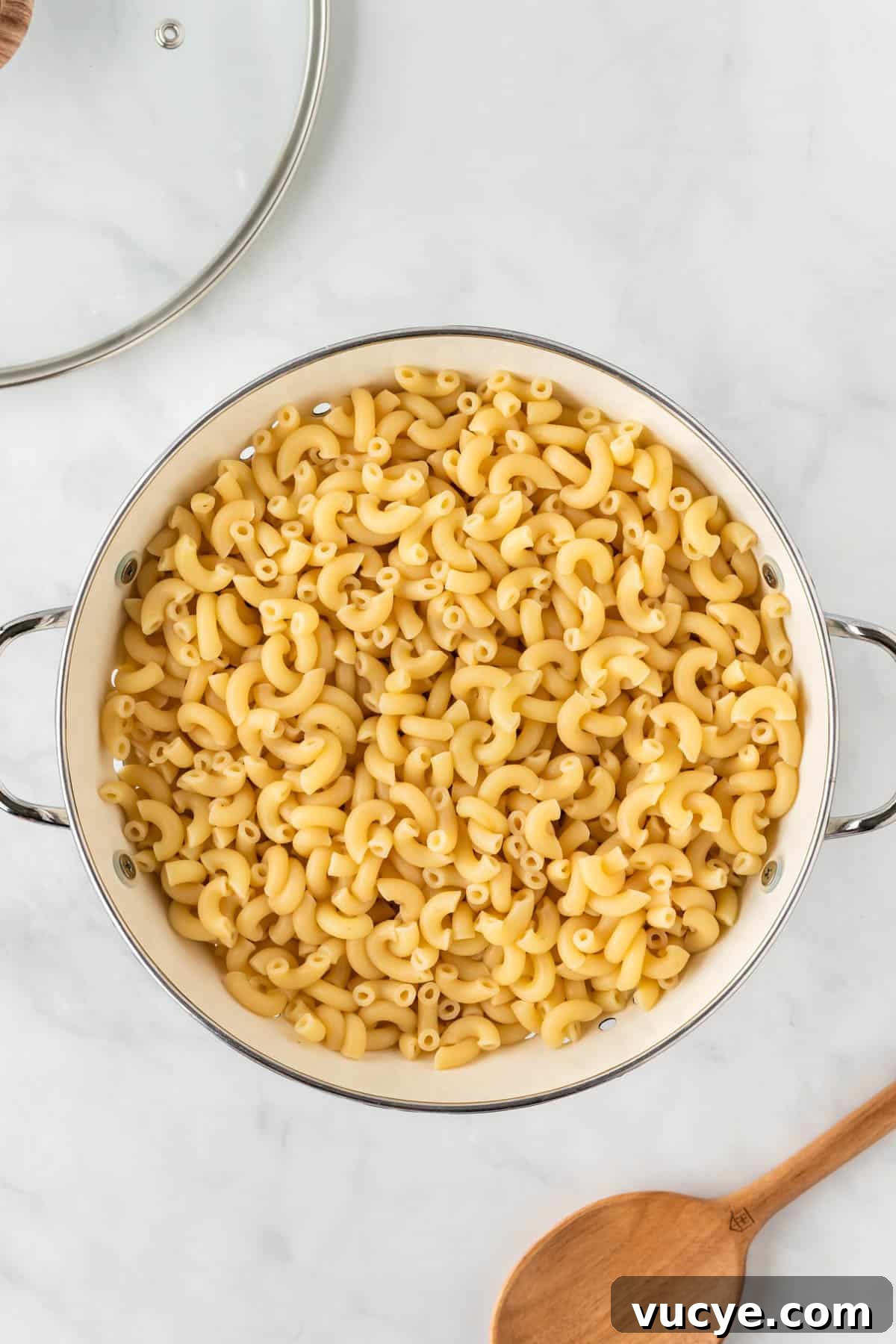 Creamy Baked Macaroni and Cheese Casserole Recipe 5 cooked macaroni noodles in a strainer