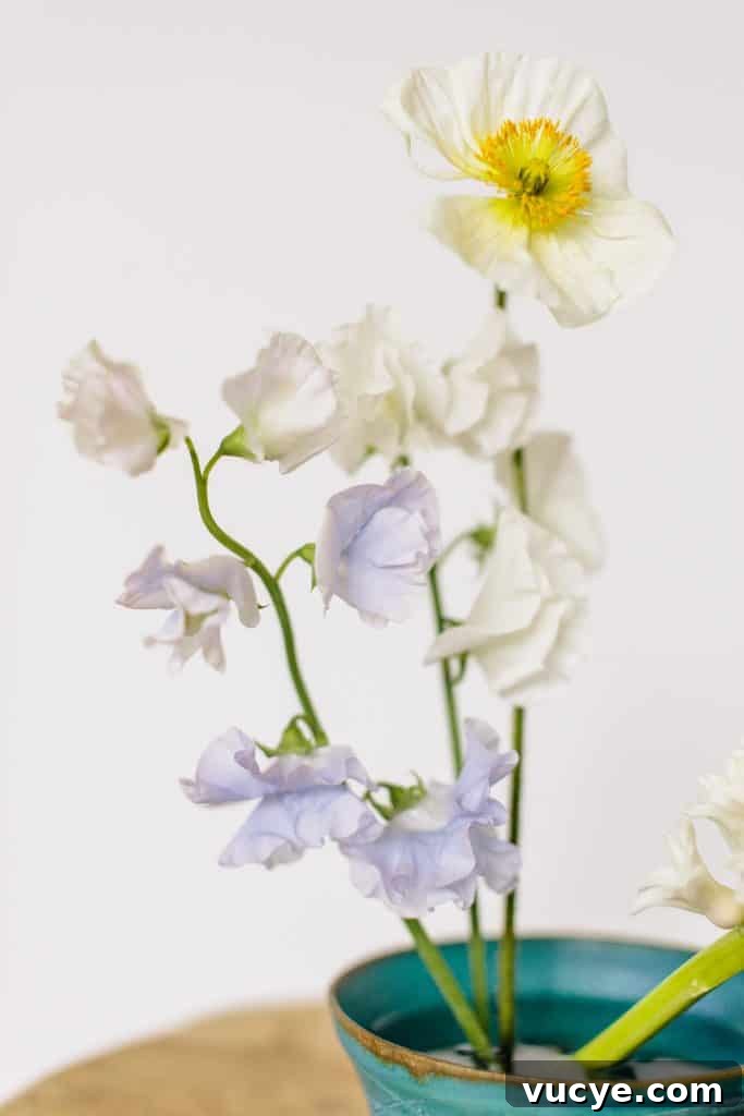 6 Elegant Ikebana Flower Arrangements for Timeless Decor 3 Minimalist Ikebana Flower Arrangement from Hello Glow