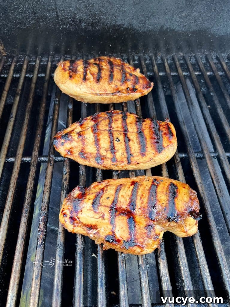 Sweet and Smoky Grilled Chicken Recipe for Weeknight Meals 9 Glaze brushing