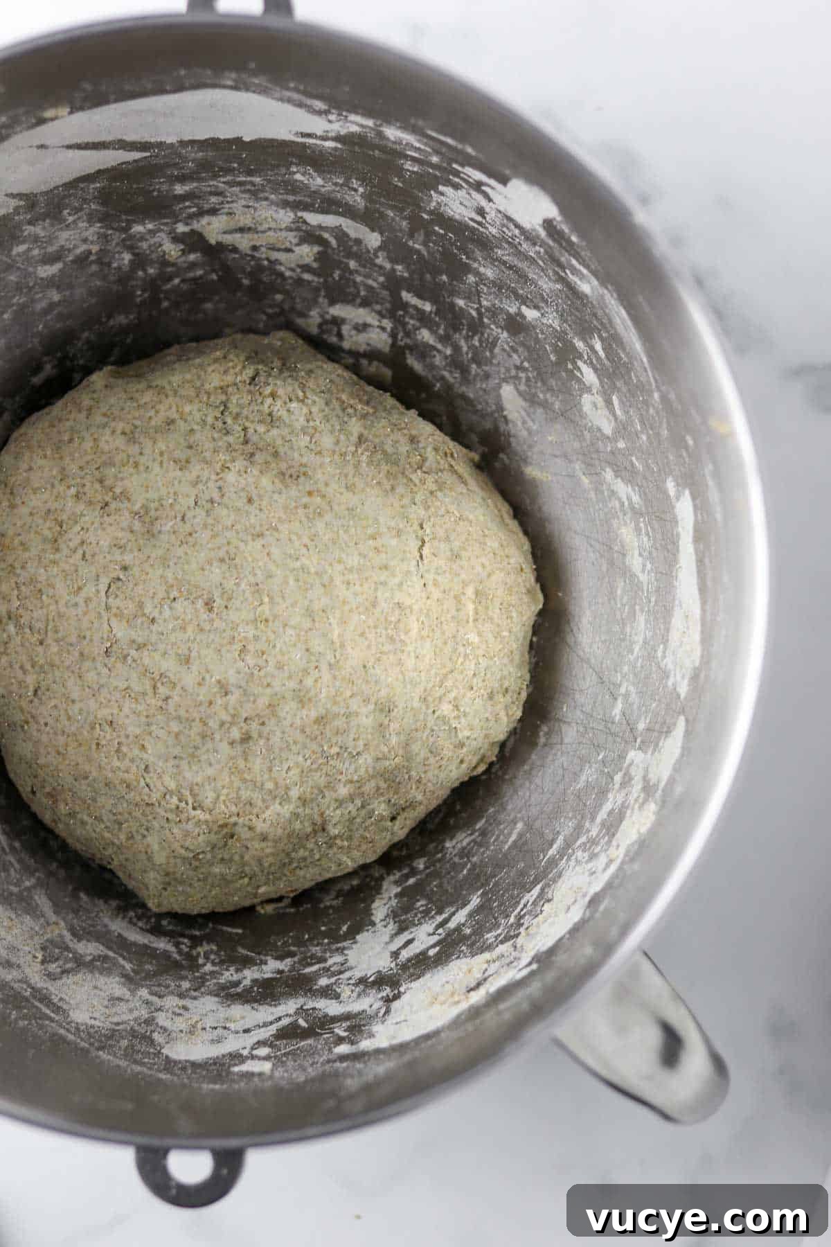Danish rye bread dough in a metal bowl.